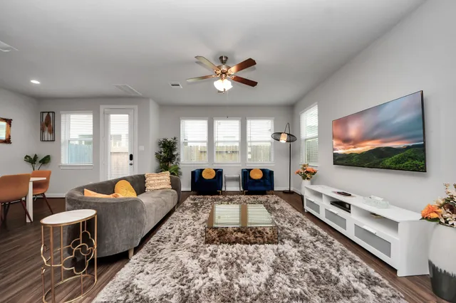 a kitchen with sink refrigerator and wooden floor