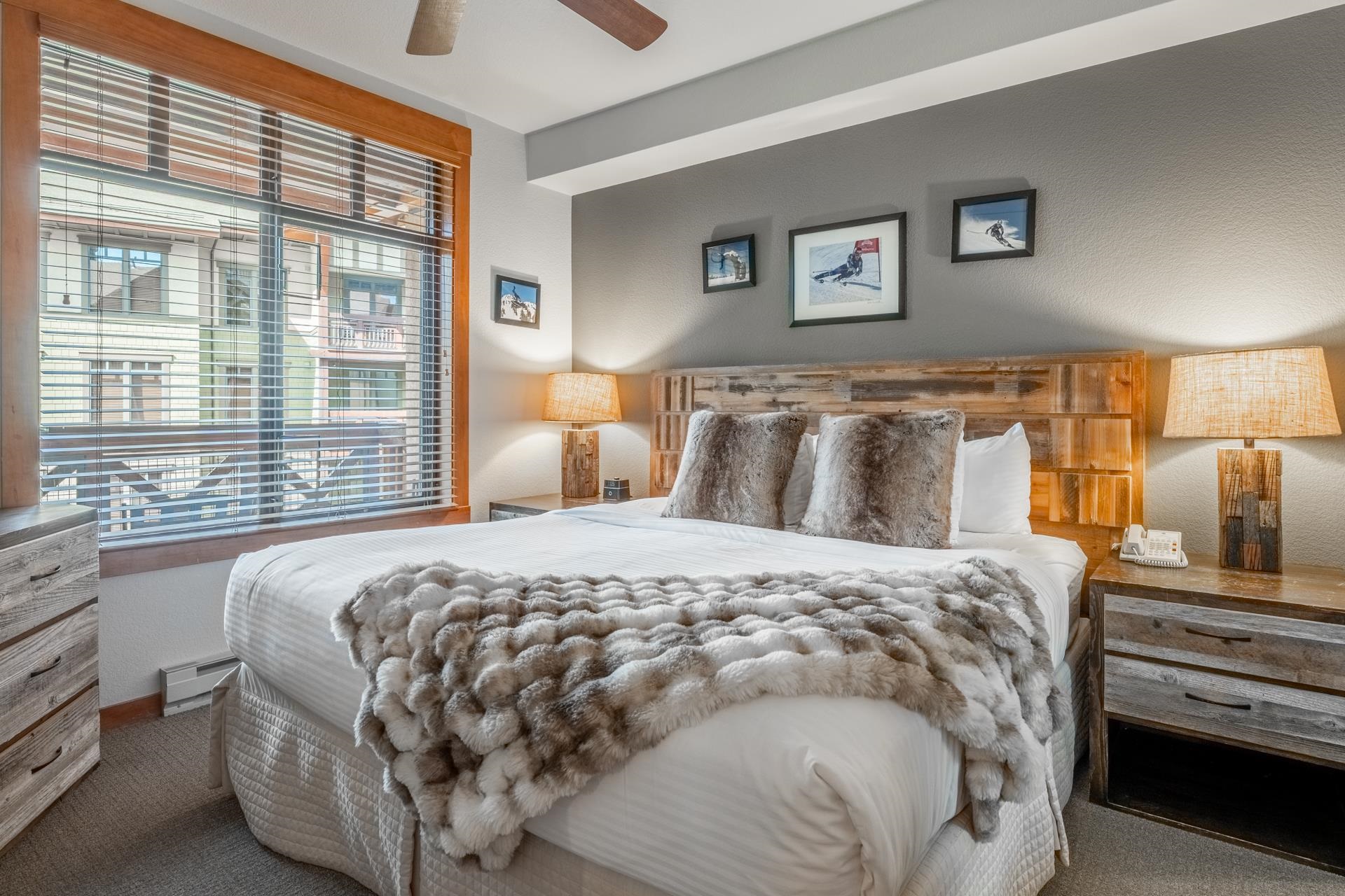 6201 Minaret Road, Unit 2328 Mammoth Lakes, CA 93546 - Photo 8 of 23 Hardwood-framed window with blinds, wood-finish headboard, wood-finish dresser, wood-finish nightstand, and ceiling fan