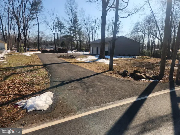 a view of a parking space with tree s