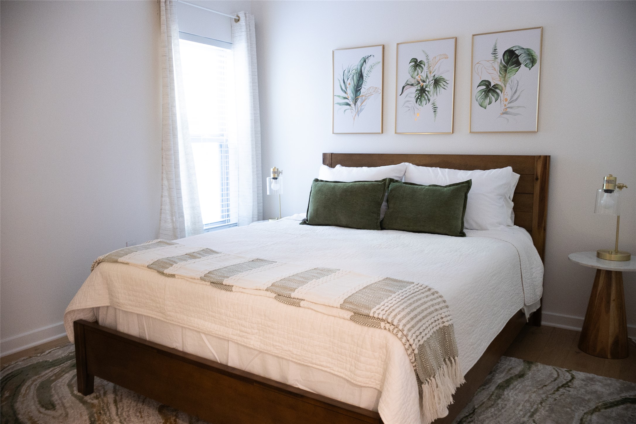 2505 Thornton Road, Unit 3108 Austin, TX 78704 - Photo 9 of 32 a bedroom with bed and painting on the wall