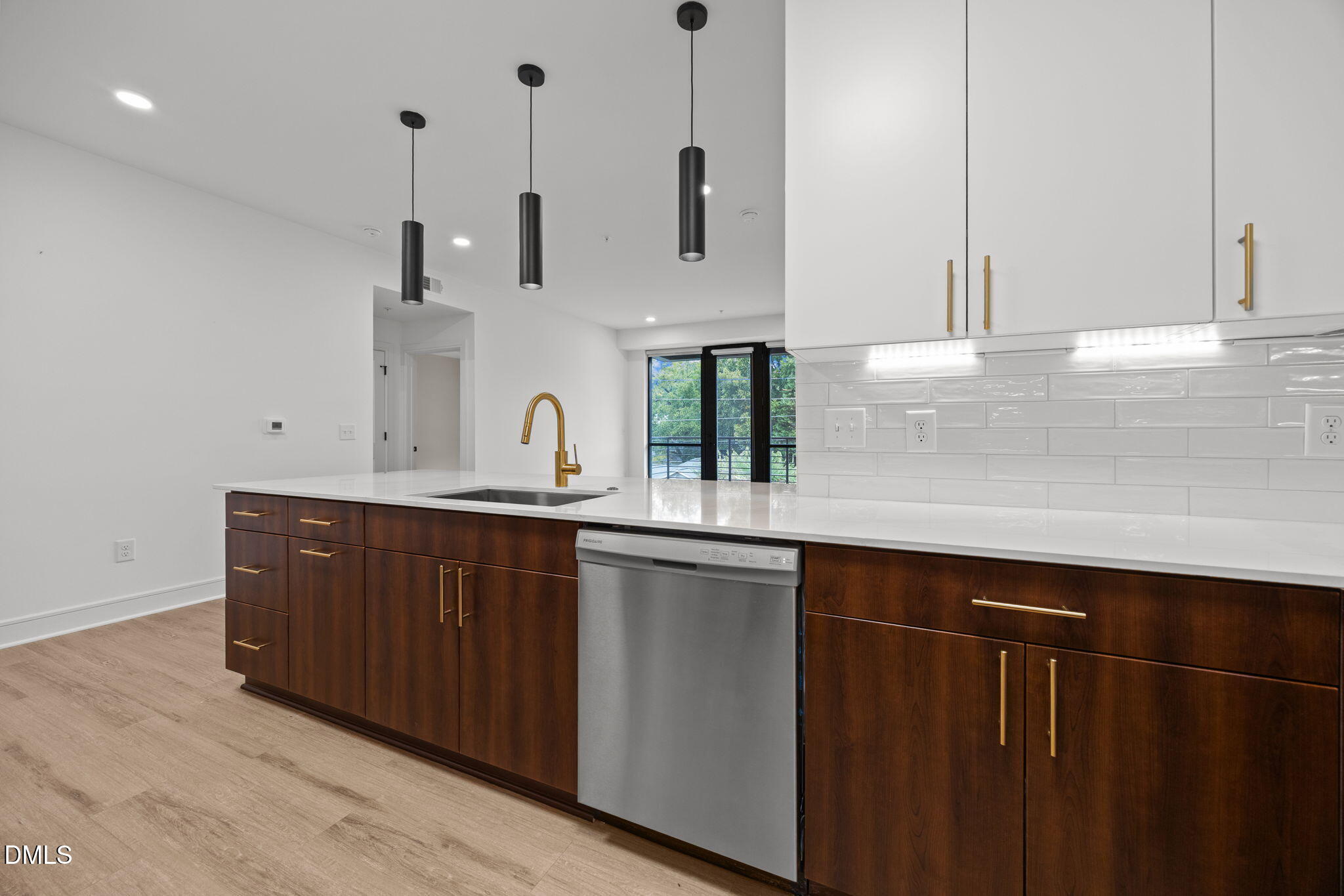 615 West Peace Street, Unit 307 Raleigh, NC 27605 - Photo 4 of 20 a kitchen with stainless steel appliances granite countertop a sink and a granite counter tops