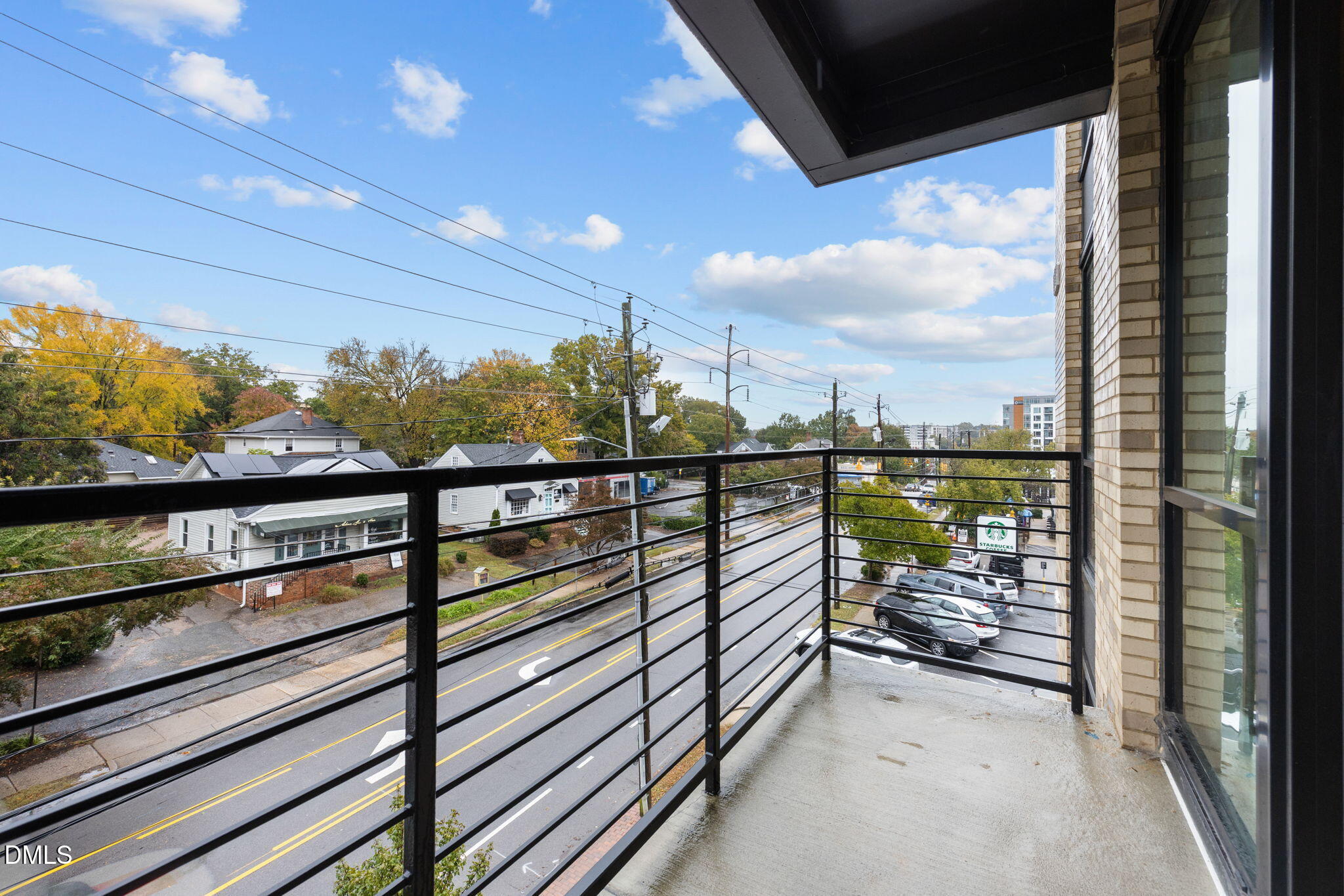 615 West Peace Street, Unit 307 Raleigh, NC 27605 - Photo 7 of 20 a view of a balcony with furniture