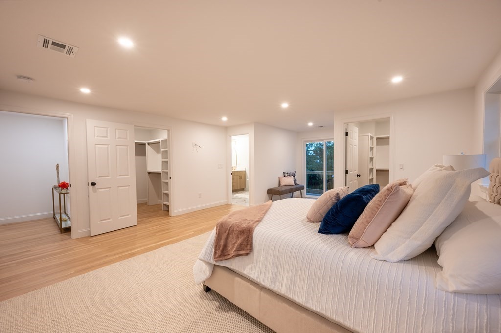 200 Hunting Road Needham, MA 02494 - Photo 12 of 31 a spacious bedroom with a bed and a large mirror