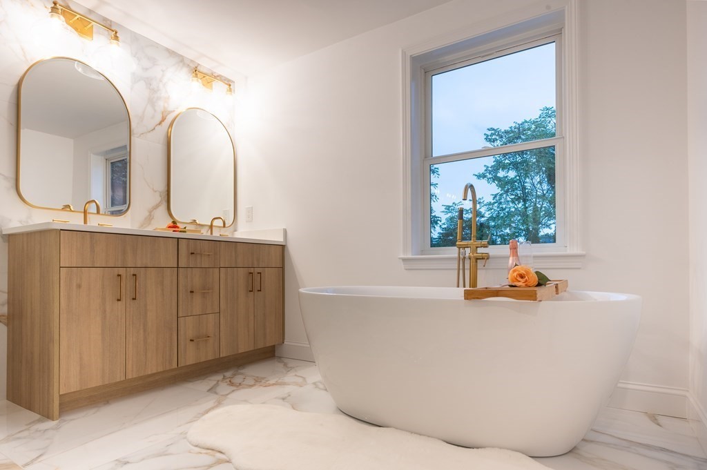 200 Hunting Road Needham, MA 02494 - Photo 13 of 31 a view of a kitchen with a sink and living area