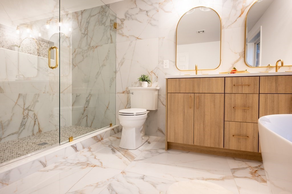 200 Hunting Road Needham, MA 02494 - Photo 14 of 31 a bathroom with a sink toilet and shower