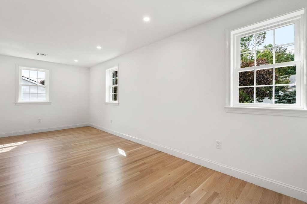 200 Hunting Road Needham, MA 02494 - Photo 21 of 31 an empty room with wooden floor and windows