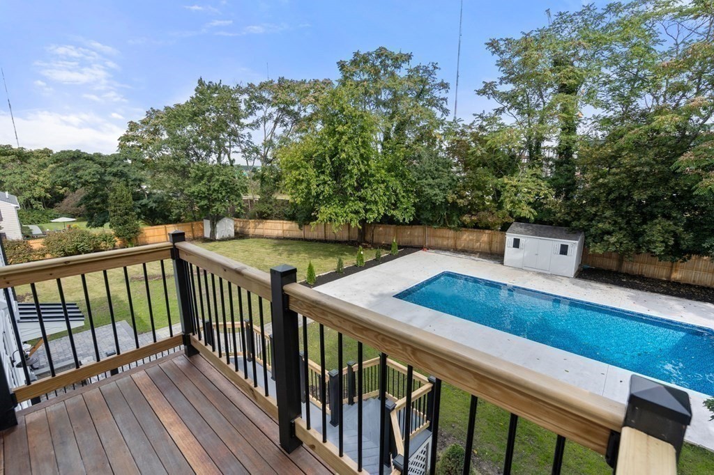 200 Hunting Road Needham, MA 02494 - Photo 30 of 31 a balcony with wooden floor and outdoor seating