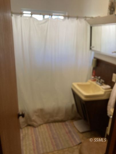 77 Adams Road Wofford Heights, CA 93285 - Photo 10 of 22 a bathroom with a sink and mirror