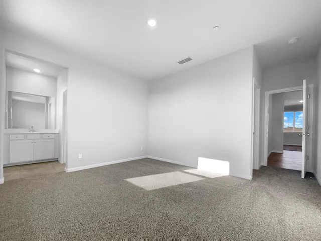 a view of a room with a sink and cabinet