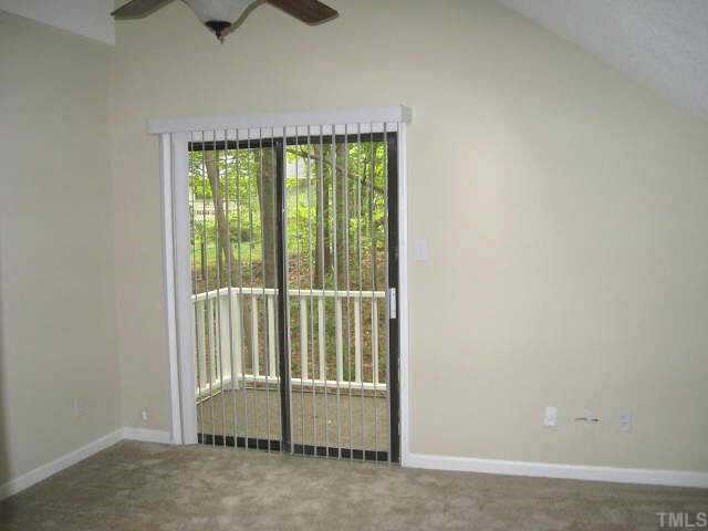 611 Brent Road Raleigh, NC 27606 - Photo 7 of 10 One of two bedrooms upstairs, this one with vaulted ceiling & balcony Other