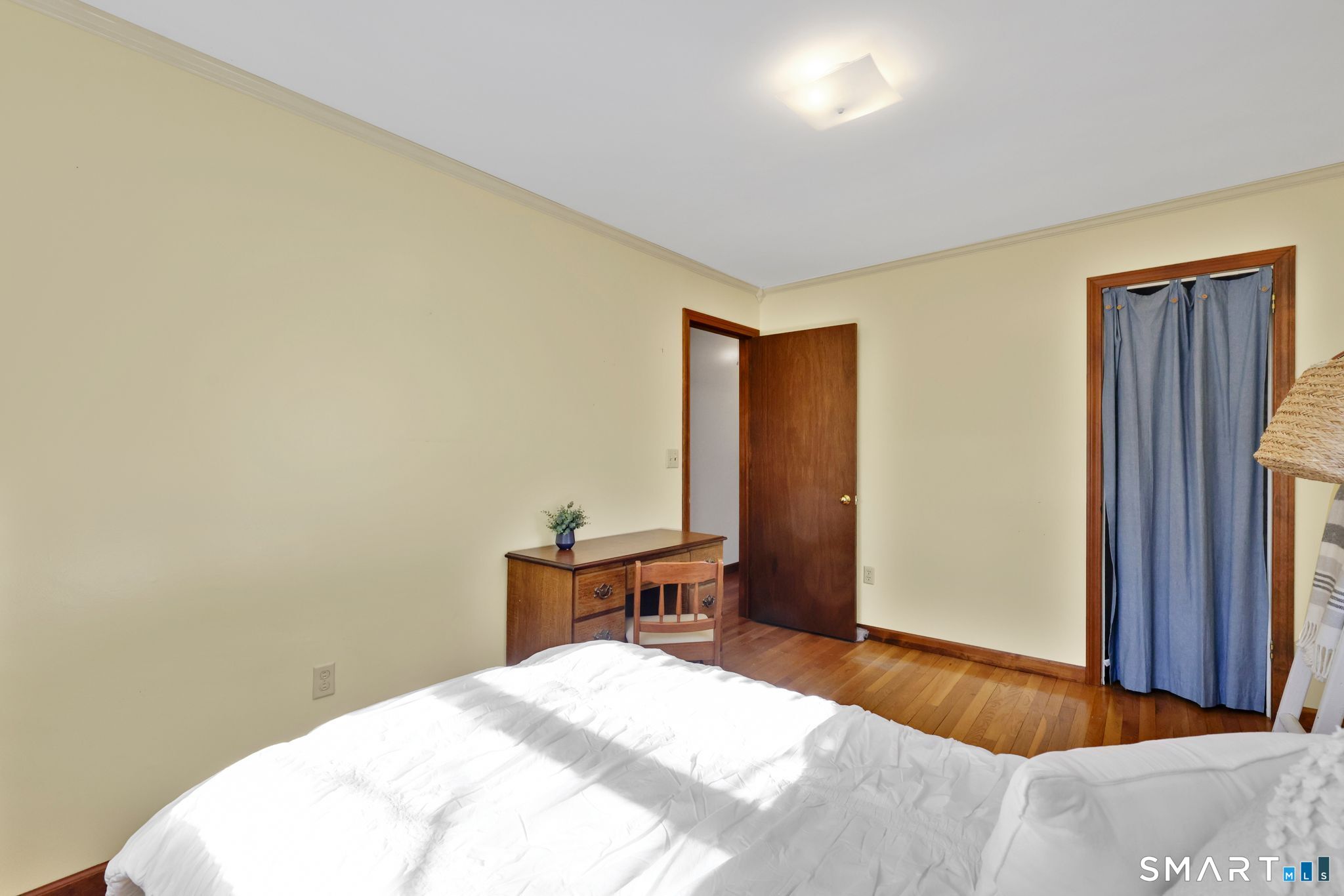 15 Johnson Road Wallingford, CT 06492 - Photo 17 of 37 a bedroom with a bed and a table in it