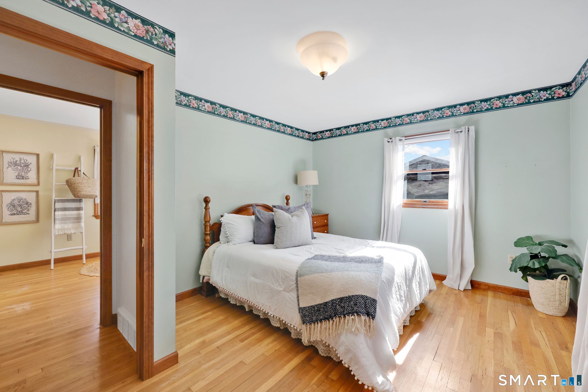 15 Johnson Road Wallingford, CT 06492 - Photo 18 of 37 a bedroom with a bed and wooden floor