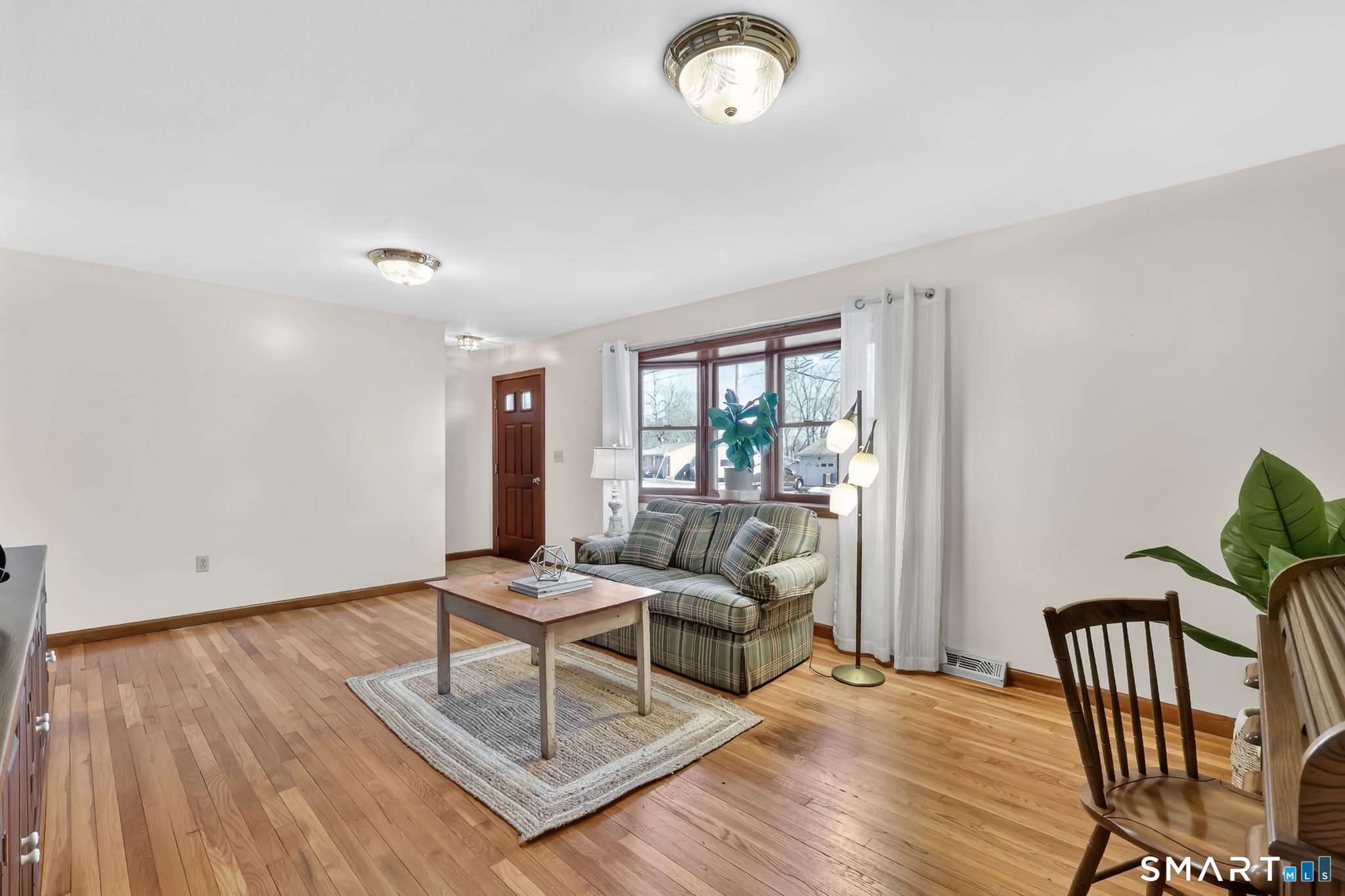 15 Johnson Road Wallingford, CT 06492 - Photo 4 of 37 a living room with furniture and wooden floor