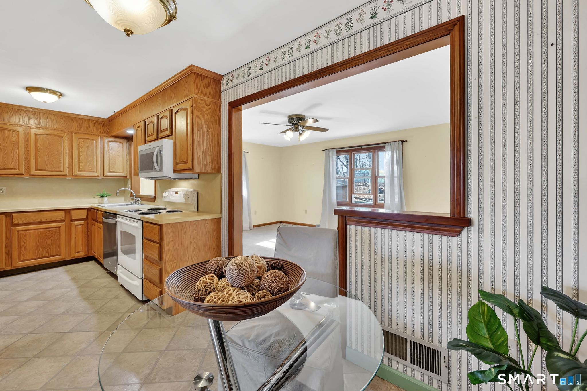 15 Johnson Road Wallingford, CT 06492 - Photo 6 of 37 a kitchen with a refrigerator and windows