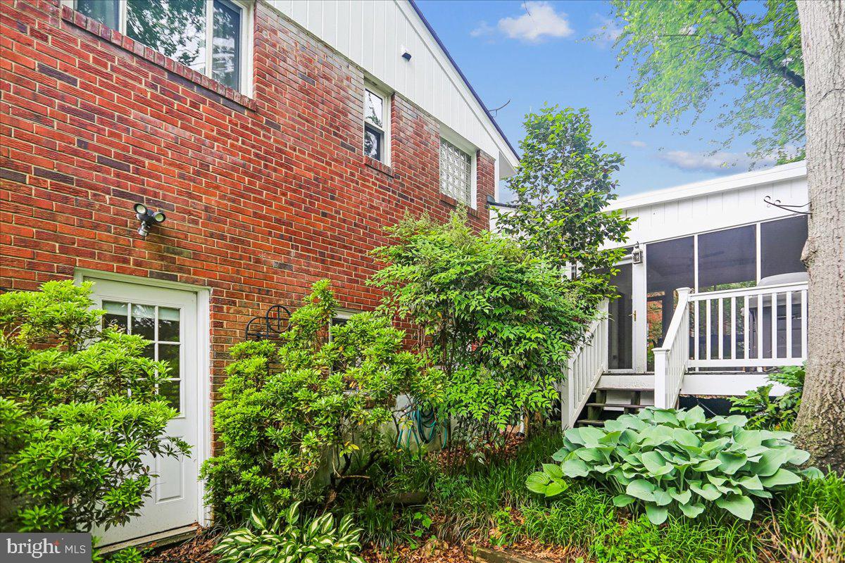 1703 Tilton Drive Silver Spring, MD 20902 - Photo 37 of 39 Charming brick facade with lush greenery.
