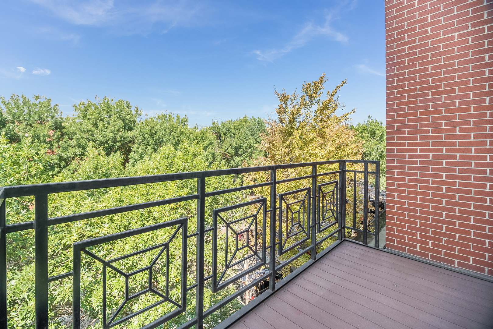 1461 South Halsted Street, Unit 3B Chicago, IL 60607 - Photo 14 of 21 a view of a balcony with wooden stairs