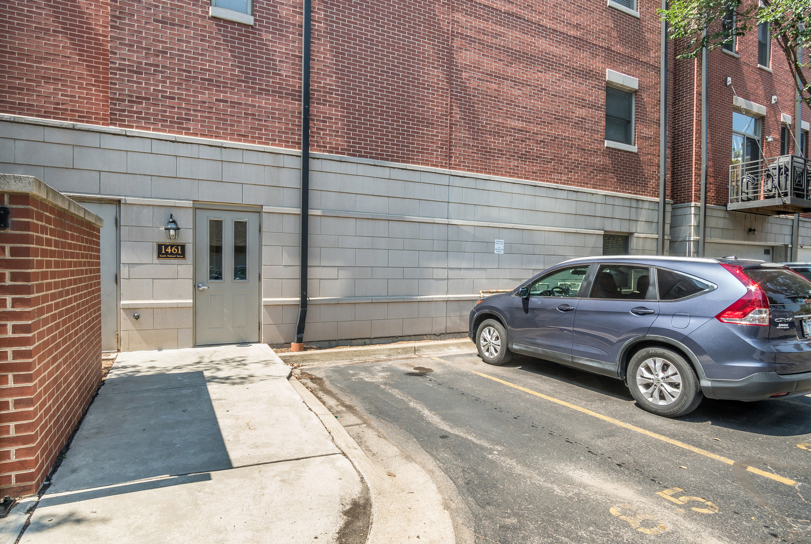 1461 South Halsted Street, Unit 3B Chicago, IL 60607 - Photo 16 of 21 a view of a car parked in front of a building