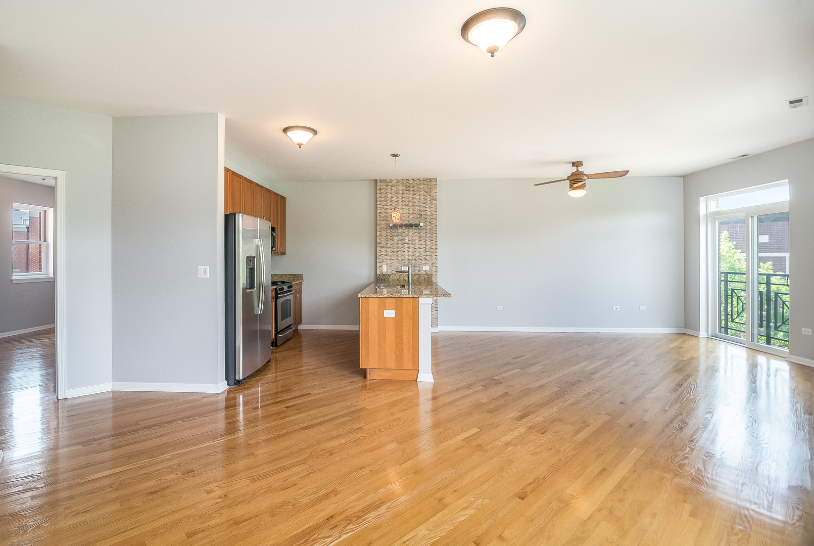 1461 South Halsted Street, Unit 3B Chicago, IL 60607 - Photo 4 of 21 a view of a livingroom with wooden floor