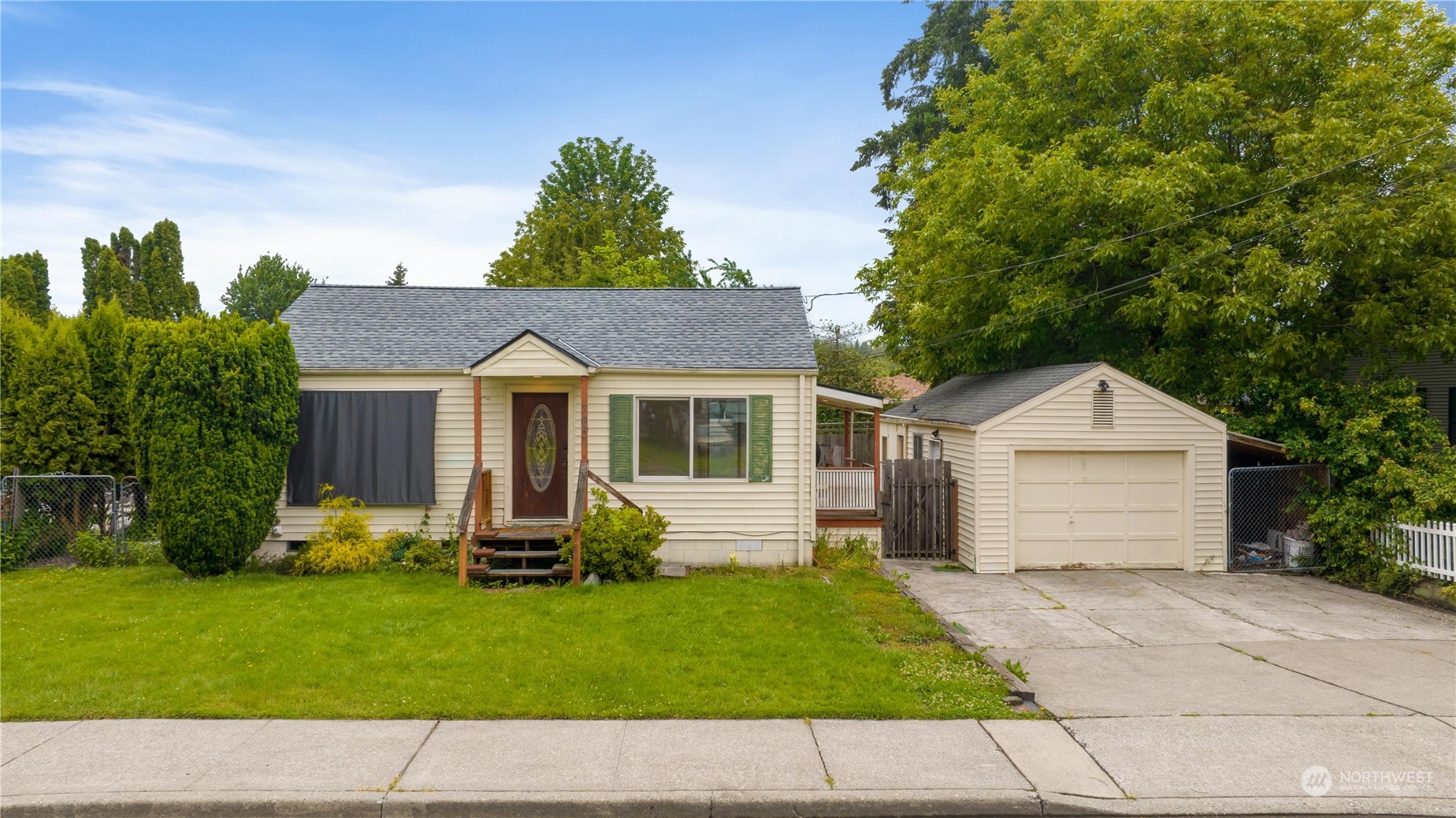 705 Main Street Sultan, WA 98294 - Photo 1 of 31 a front view of a house with a yard