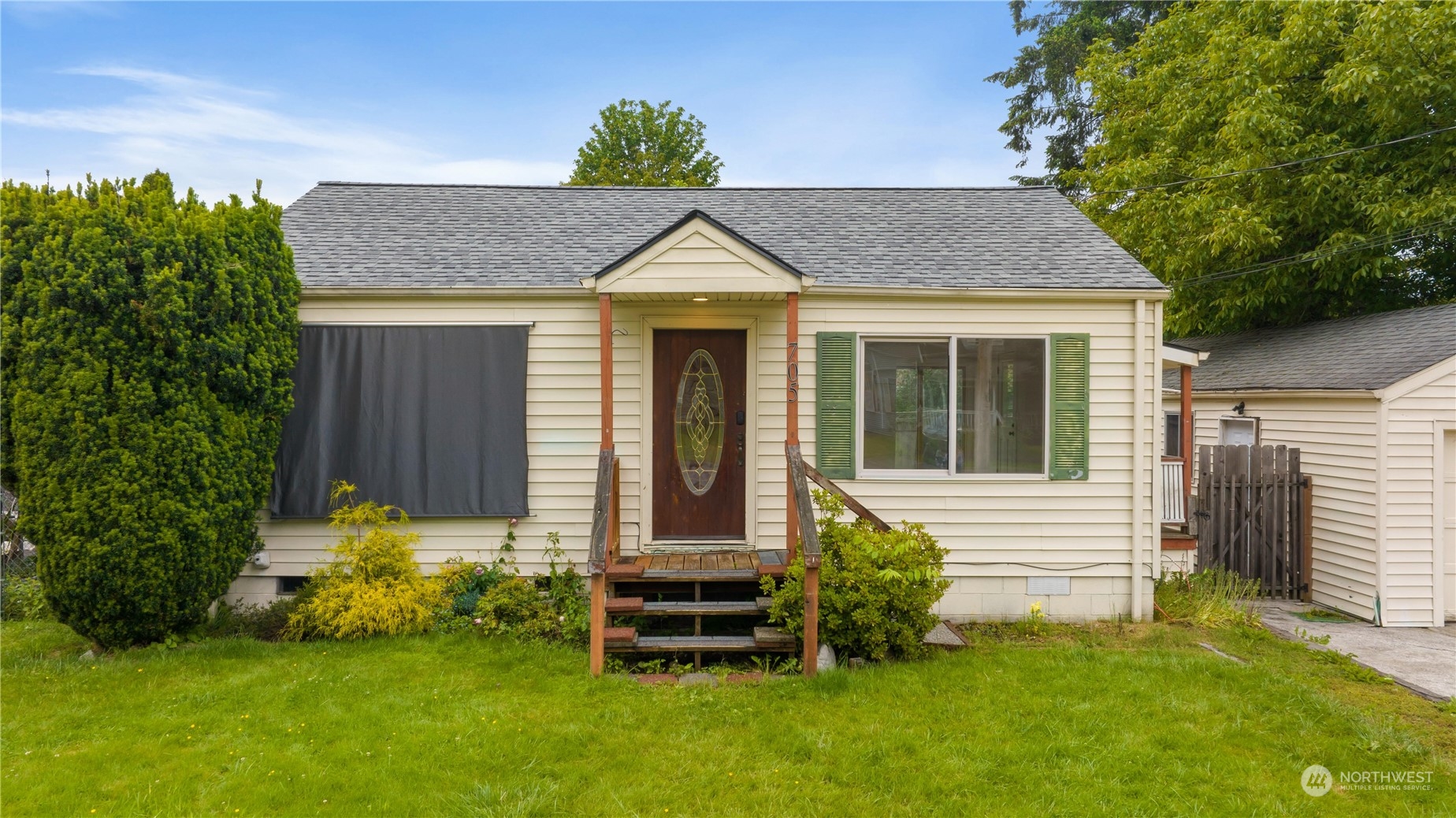 705 Main Street Sultan, WA 98294 - Photo 2 of 31 a view of a house with a yard