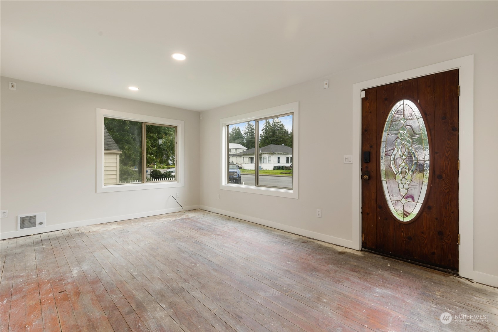 705 Main Street Sultan, WA 98294 - Photo 6 of 31 an empty room with entrance and a window