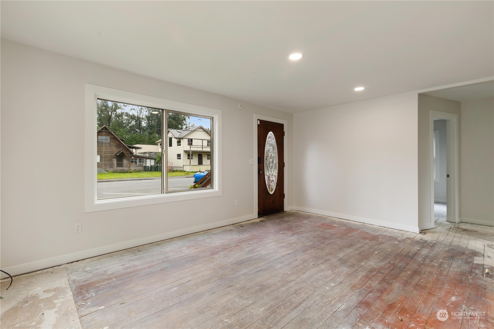 705 Main Street Sultan, WA 98294 - Photo 7 of 31 an empty room with windows