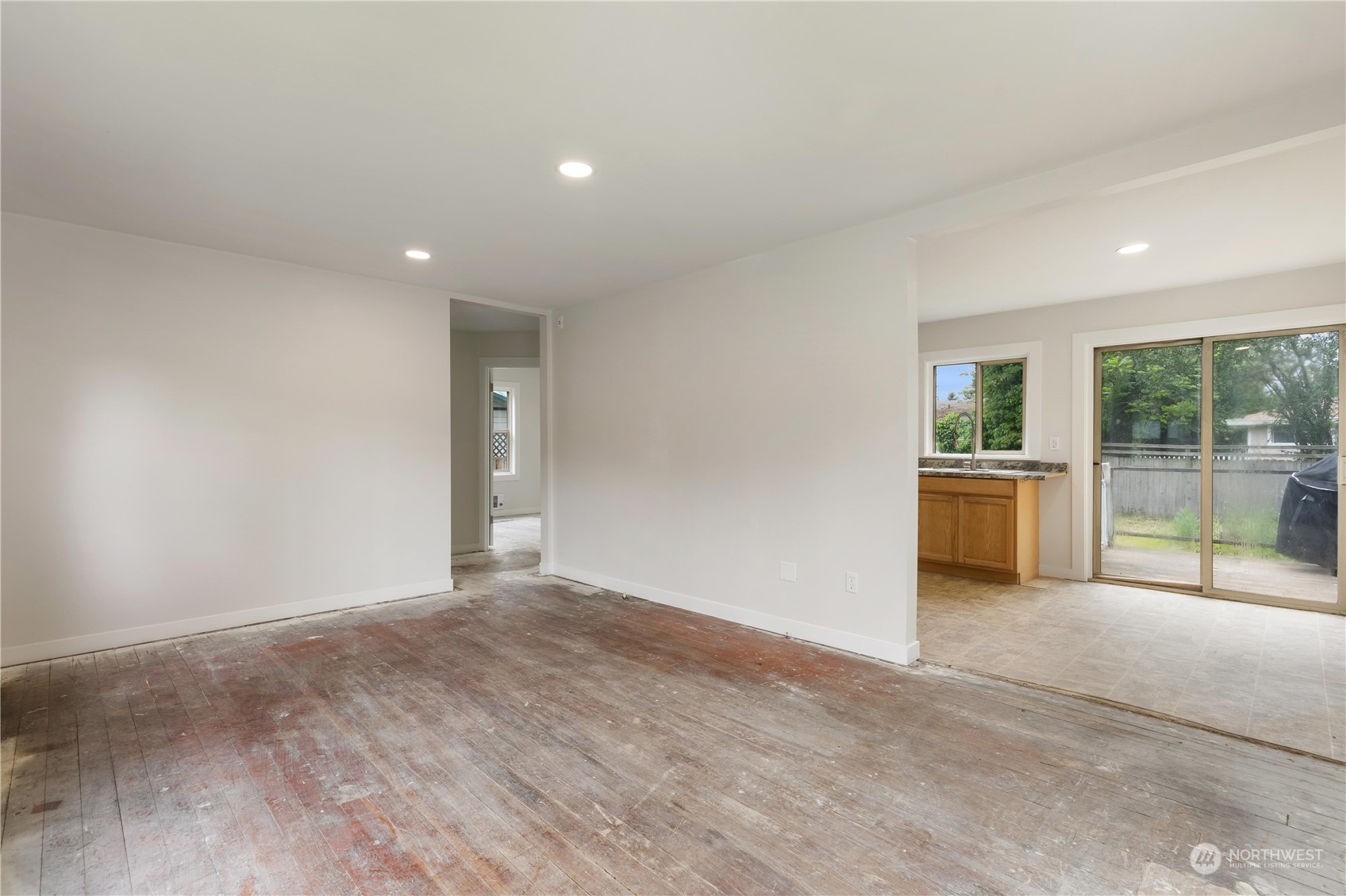 705 Main Street Sultan, WA 98294 - Photo 8 of 31 a view of a big room with wooden floor and windows
