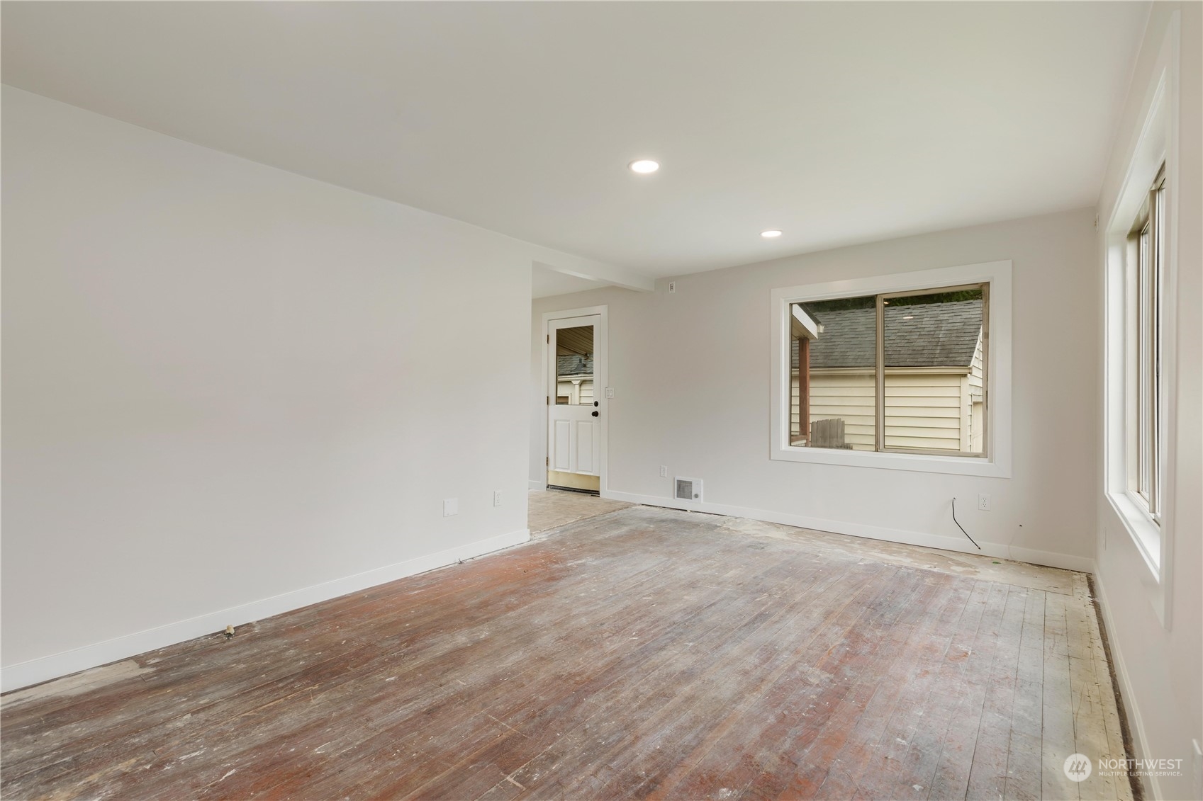 705 Main Street Sultan, WA 98294 - Photo 9 of 31 wooden floor in an empty room with a window