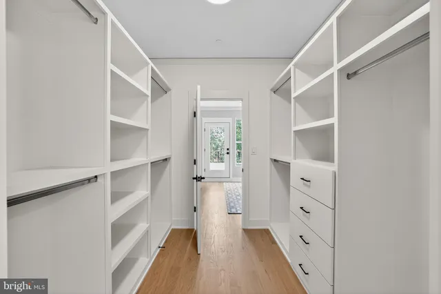 a bathroom with a shower sink and mirror