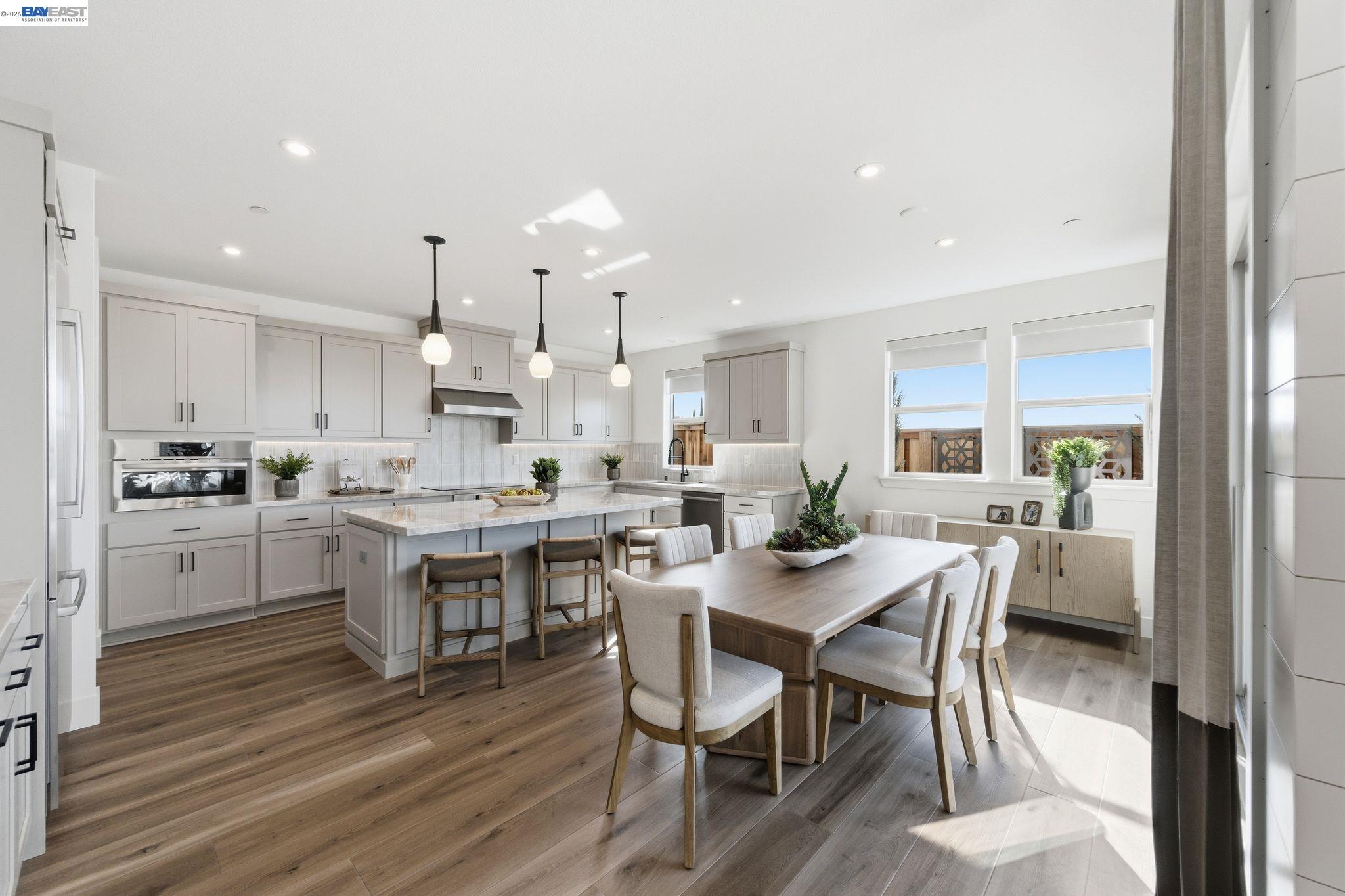 3952 Viggo Way Dublin, CA 94568 - Photo 13 of 39 a large kitchen with a table and chairs