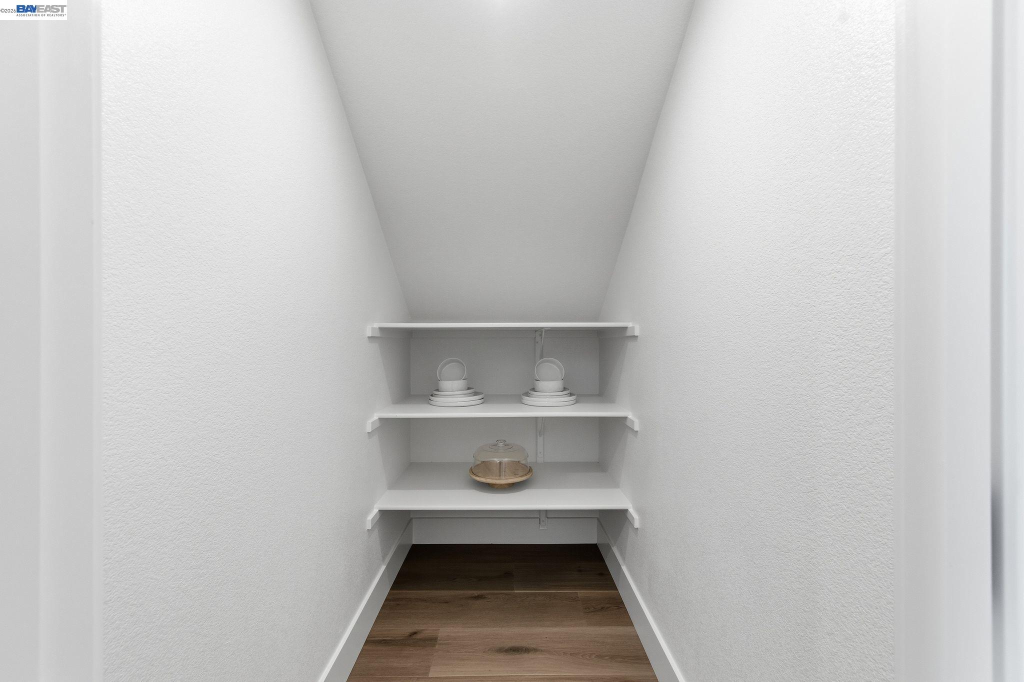 3952 Viggo Way Dublin, CA 94568 - Photo 17 of 39 a room with a wooden floor and shelf