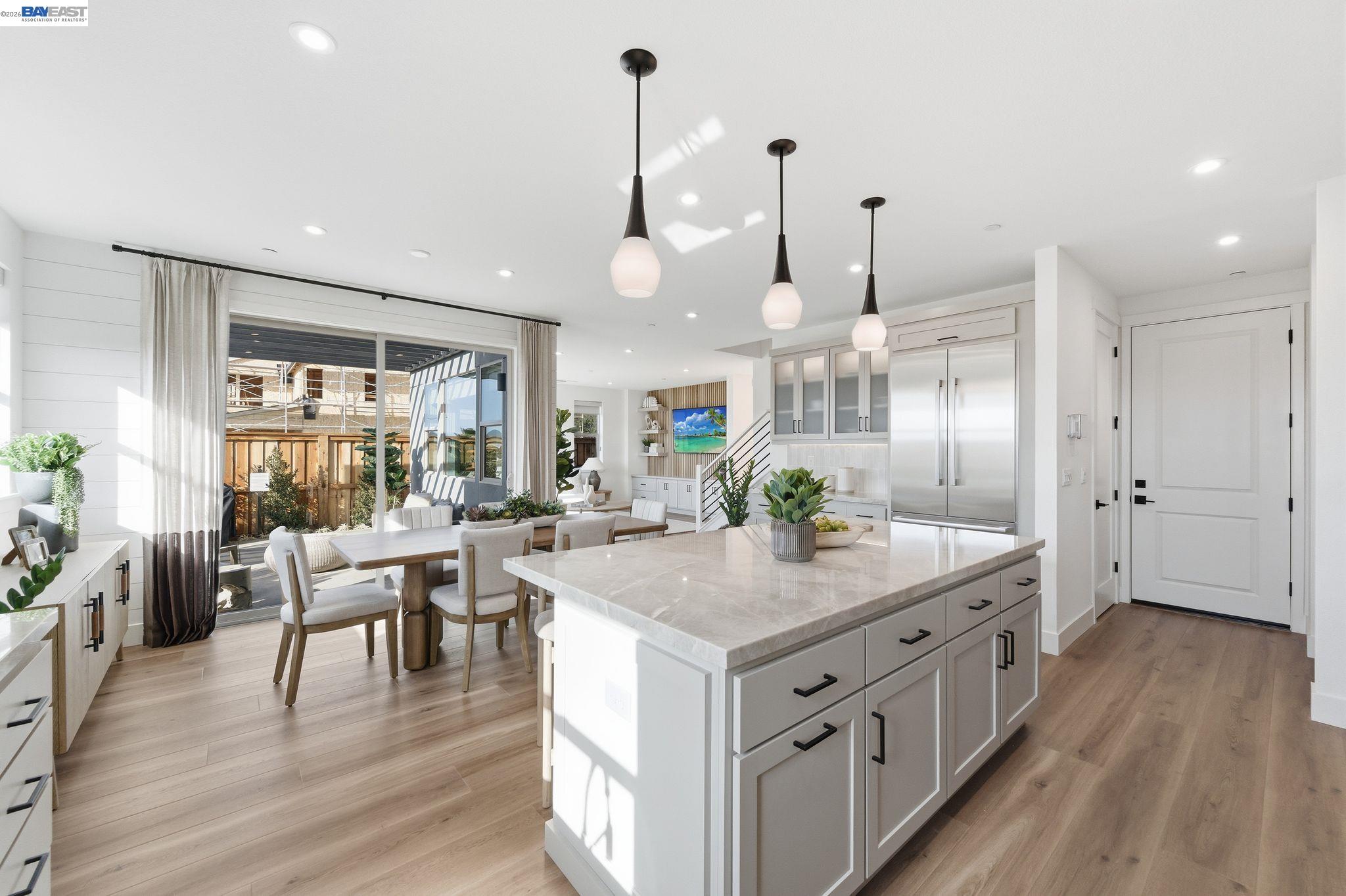 3952 Viggo Way Dublin, CA 94568 - Photo 19 of 39 a kitchen with stainless steel appliances granite countertop a stove and a wooden floors