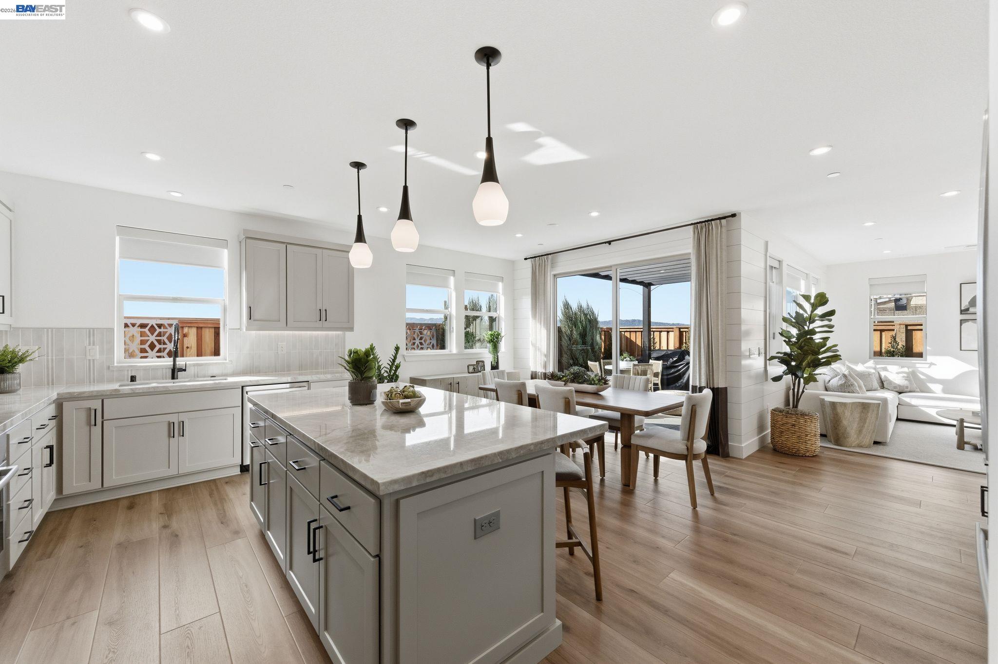 3952 Viggo Way Dublin, CA 94568 - Photo 2 of 39 a kitchen with a sink stove and wooden floor