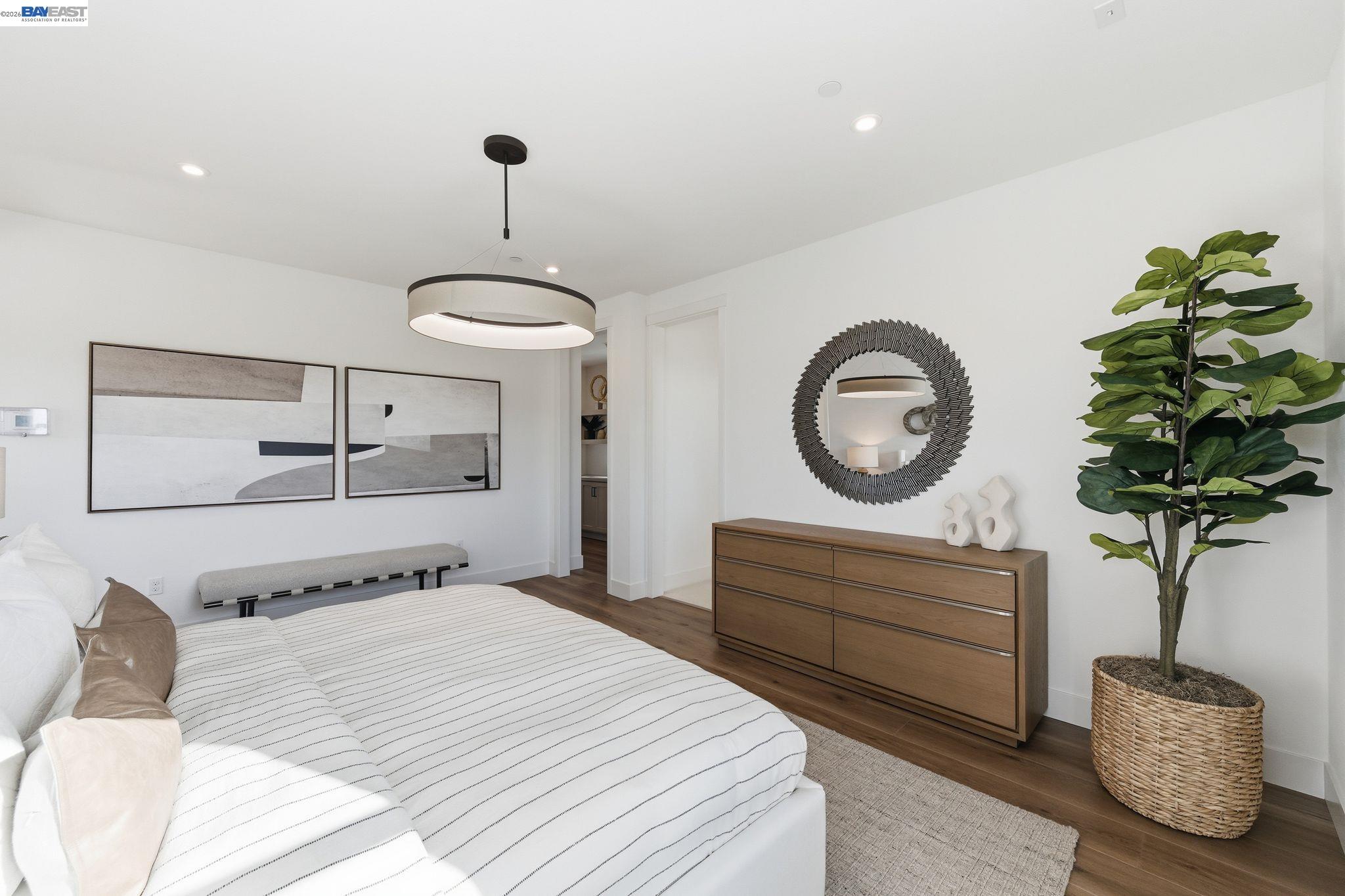 3952 Viggo Way Dublin, CA 94568 - Photo 25 of 39 a bedroom with a bed and a chandelier