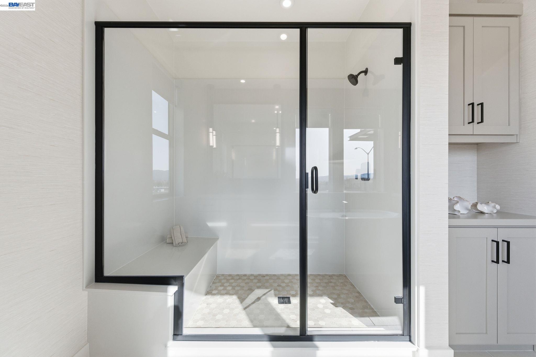 3952 Viggo Way Dublin, CA 94568 - Photo 28 of 39 a bathroom with a glass shower door
