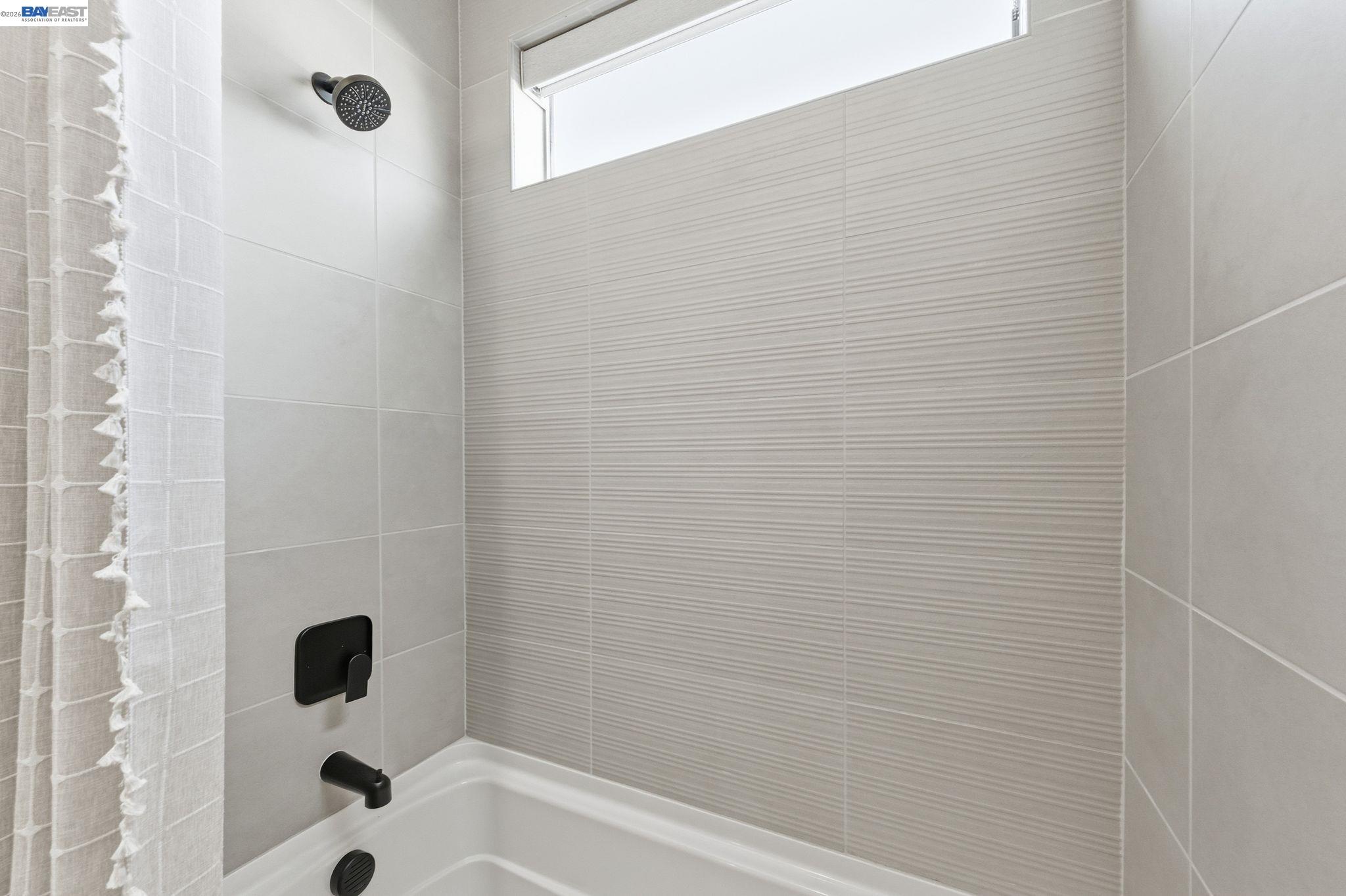 3952 Viggo Way Dublin, CA 94568 - Photo 33 of 39 a bathroom with a bathtub