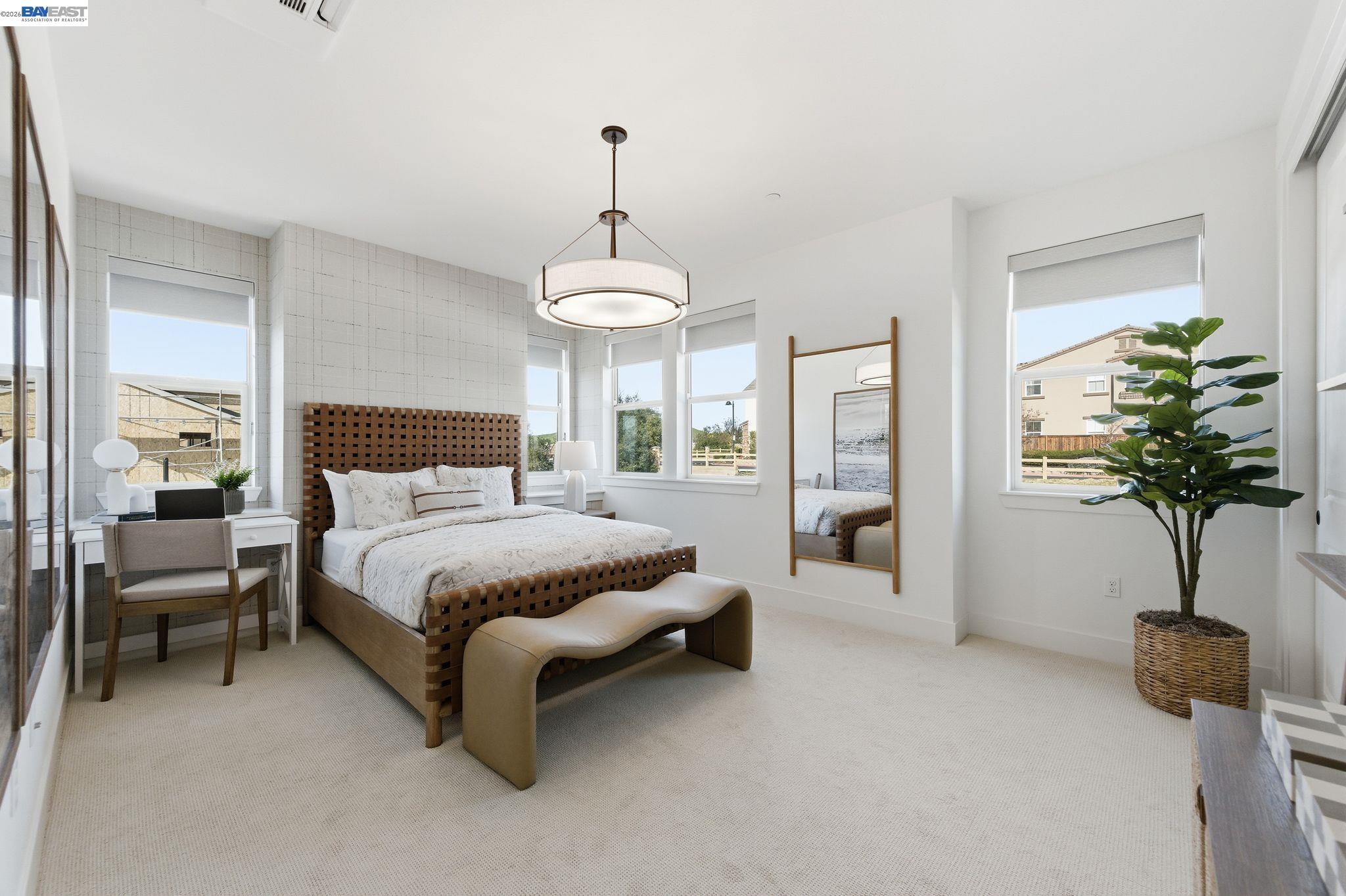 3952 Viggo Way Dublin, CA 94568 - Photo 35 of 39 a bedroom with a bed and a chandelier