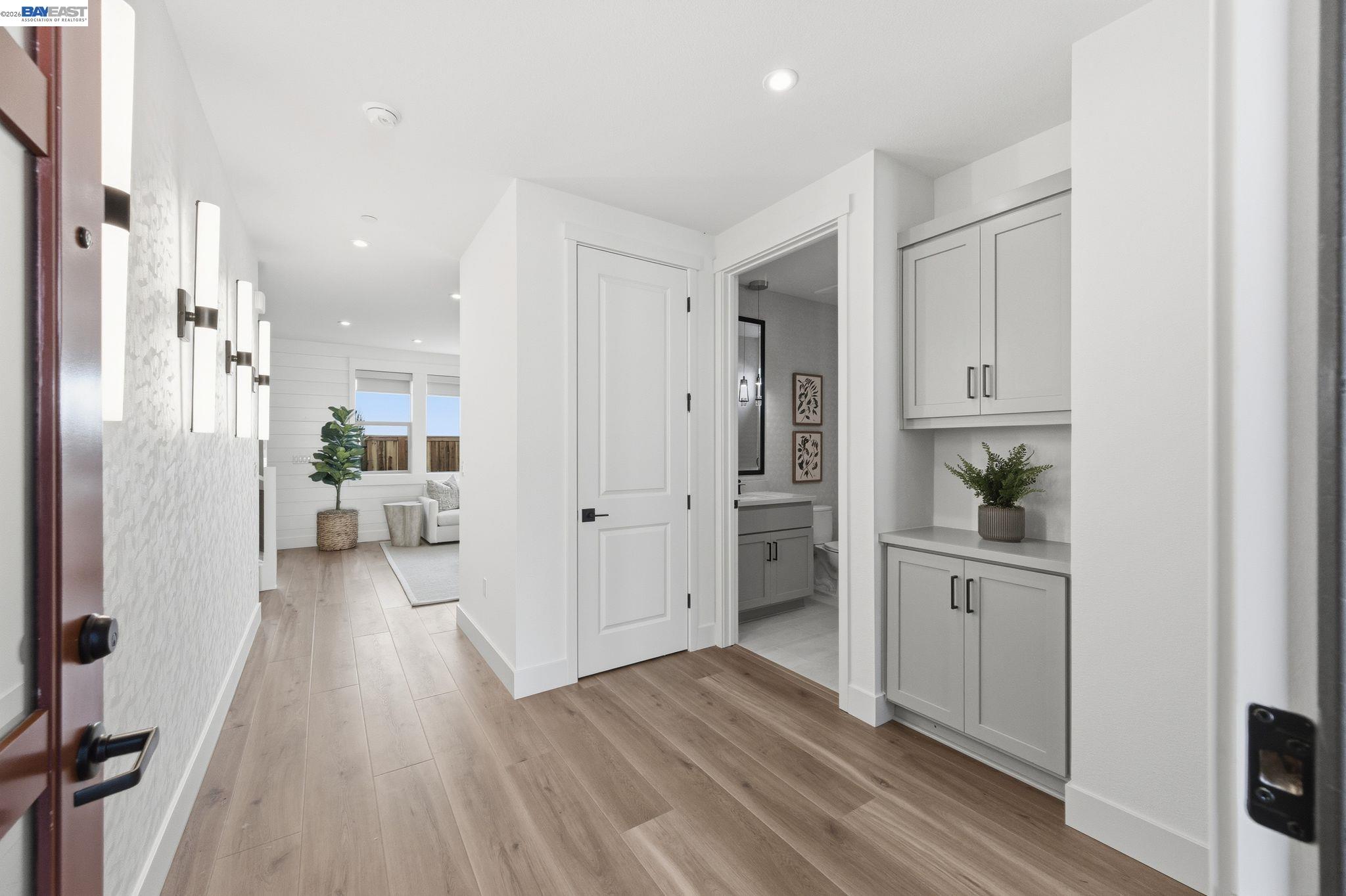 3952 Viggo Way Dublin, CA 94568 - Photo 5 of 39 a view of a hallway with wooden floor and a living room