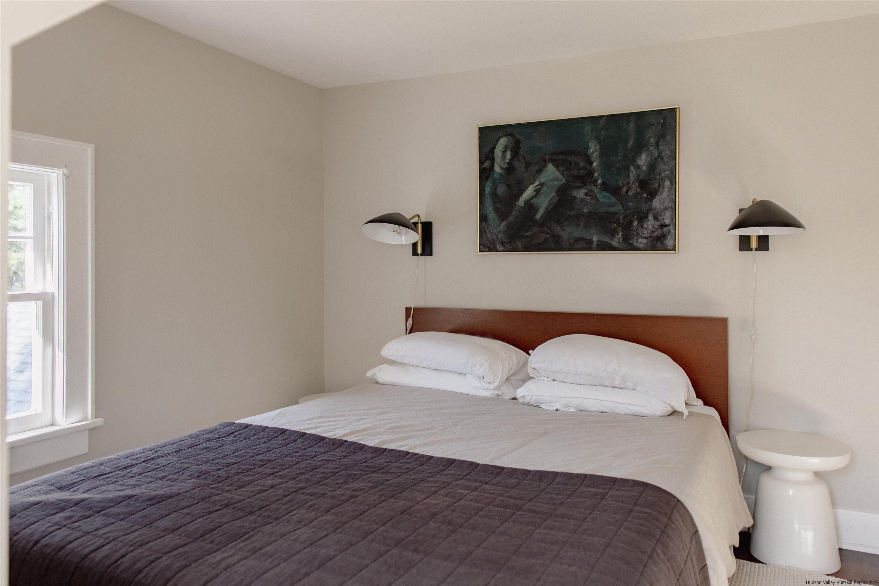 2814 County Road Cornwallville, NY 12418 - Photo 22 of 34 a bedroom with a bed and a painting on the wall