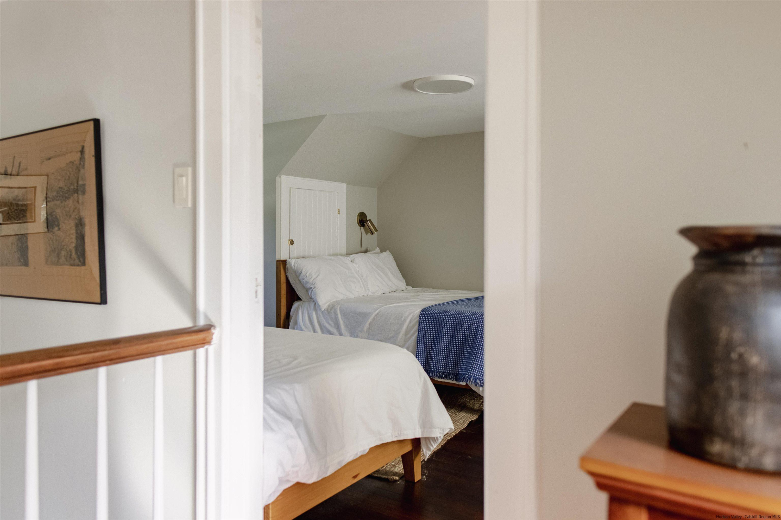 2814 County Road Cornwallville, NY 12418 - Photo 23 of 34 a bedroom with bed and a chair