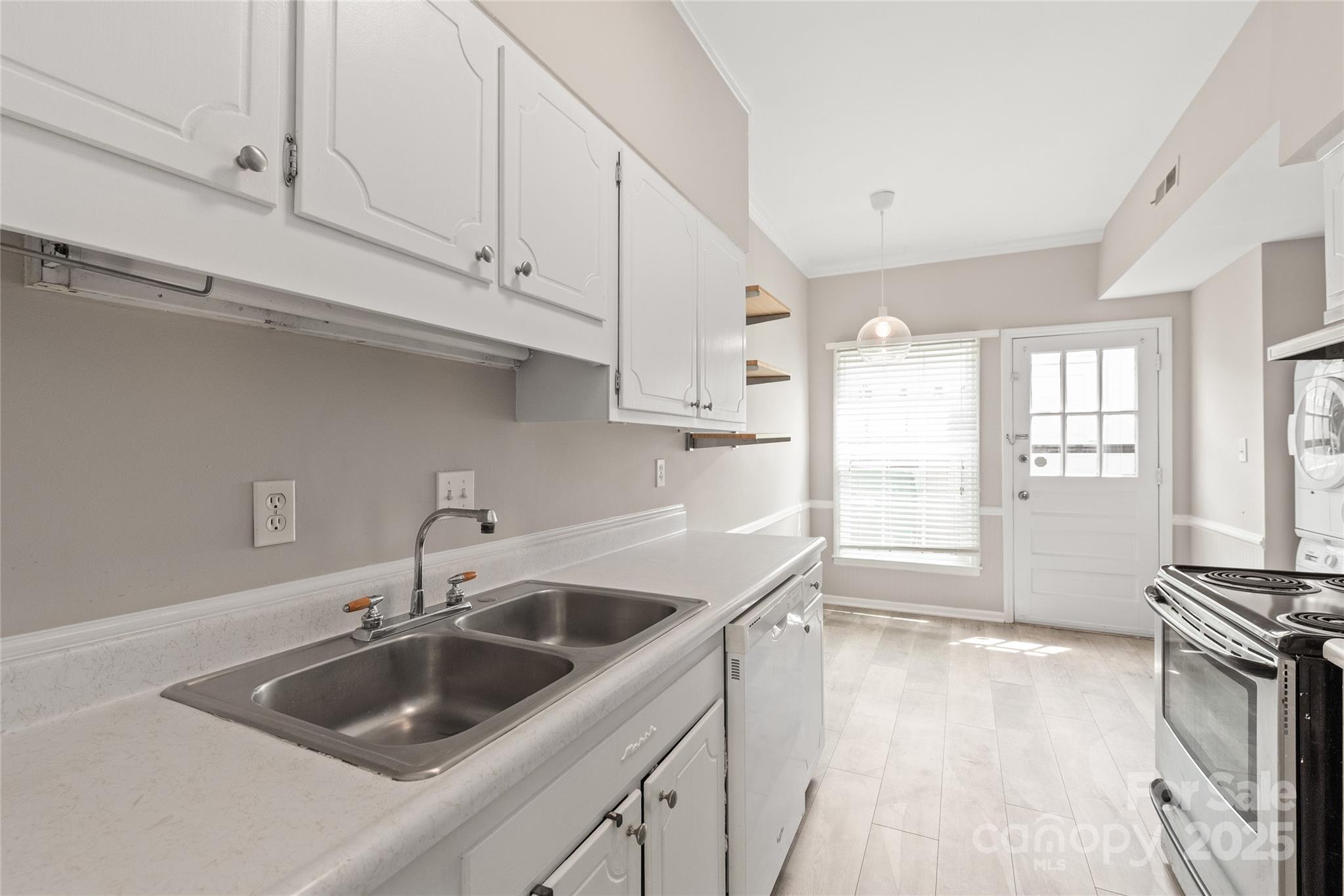 5949 Quail Hollow Road, Unit E Charlotte, NC 28210 - Photo 13 of 27 a kitchen with a sink and cabinets