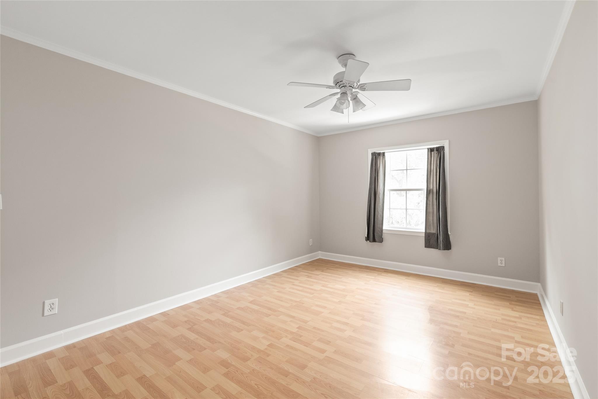 5949 Quail Hollow Road, Unit E Charlotte, NC 28210 - Photo 23 of 27 wooden floor in an empty room with a window