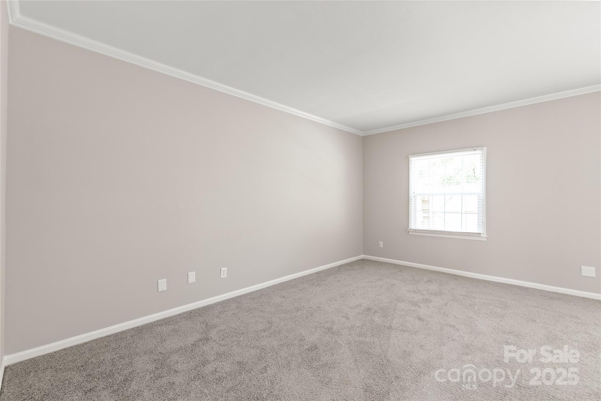 5949 Quail Hollow Road, Unit E Charlotte, NC 28210 - Photo 4 of 27 an empty room with a window