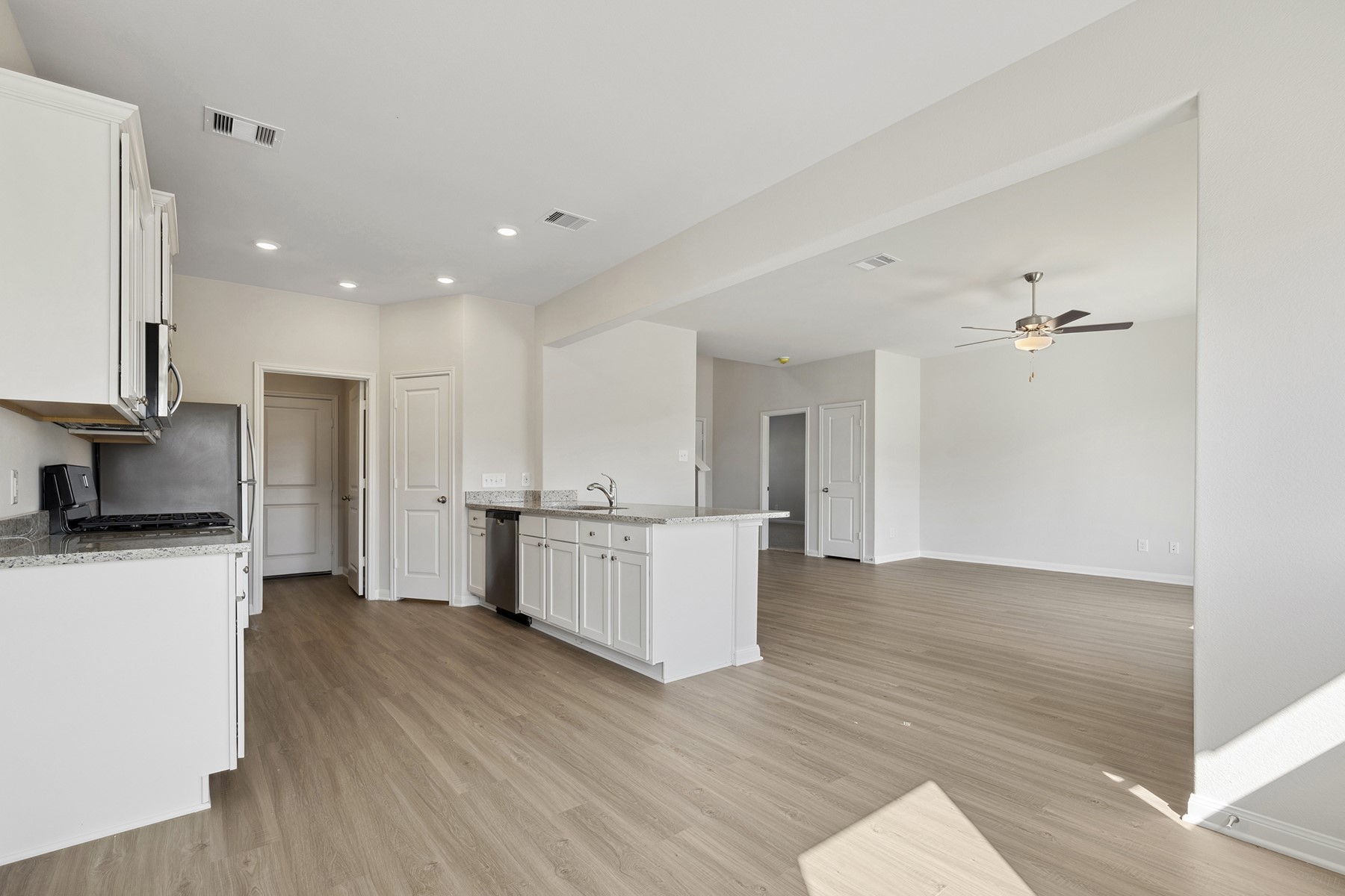 324 Fastboy Lane Waller, TX 77484 - Photo 5 of 13 a view of a kitchen with wooden floor