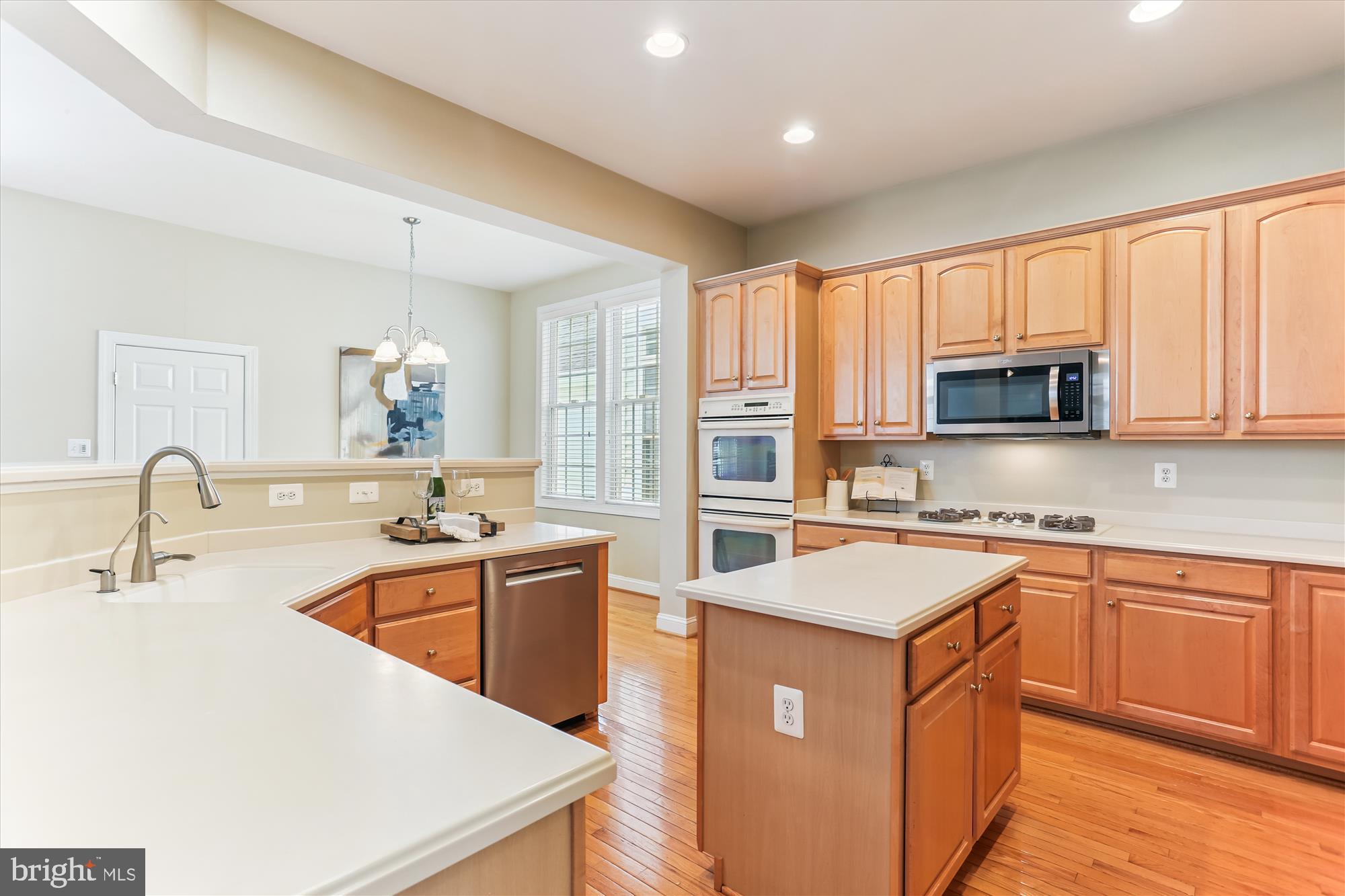 713 Bright Meadow Drive Gaithersburg, MD 20878 - Photo 12 of 54 a kitchen with stainless steel appliances granite countertop a sink stove and refrigerator