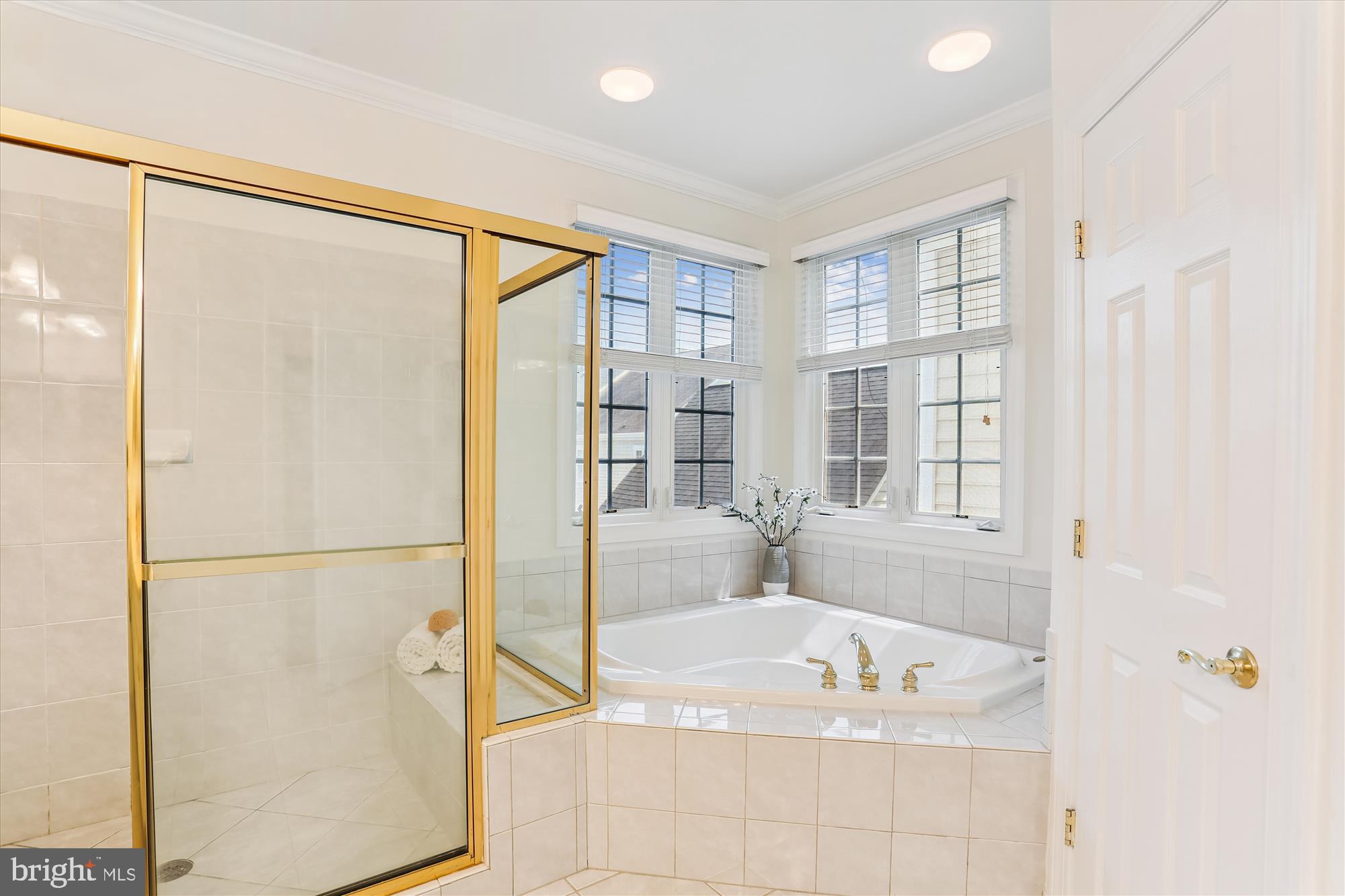713 Bright Meadow Drive Gaithersburg, MD 20878 - Photo 25 of 54 a bathroom with a tub and a shower