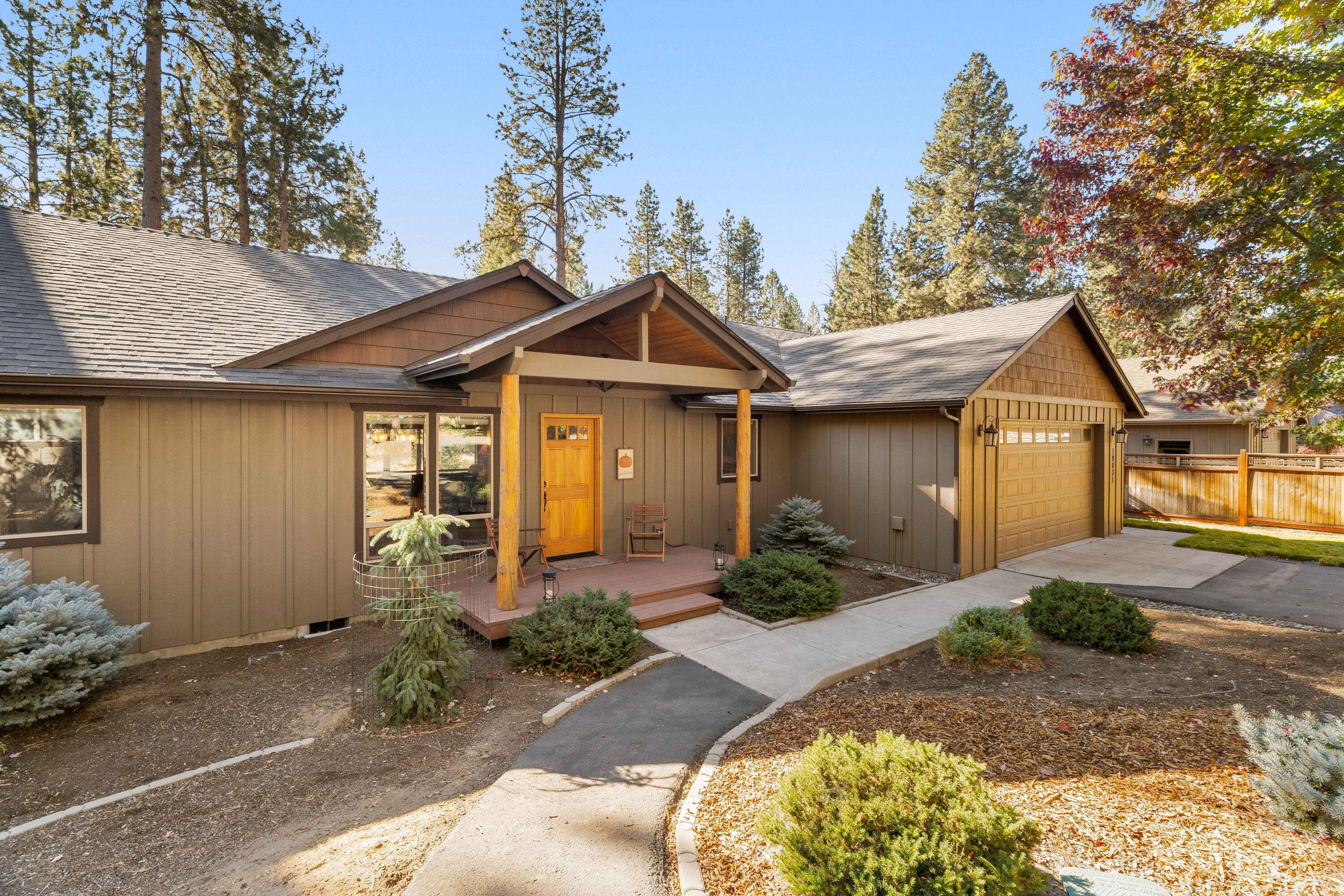 19031 Baker Road Bend, OR 97702 - Photo 1 of 35 a front view of a house with garden