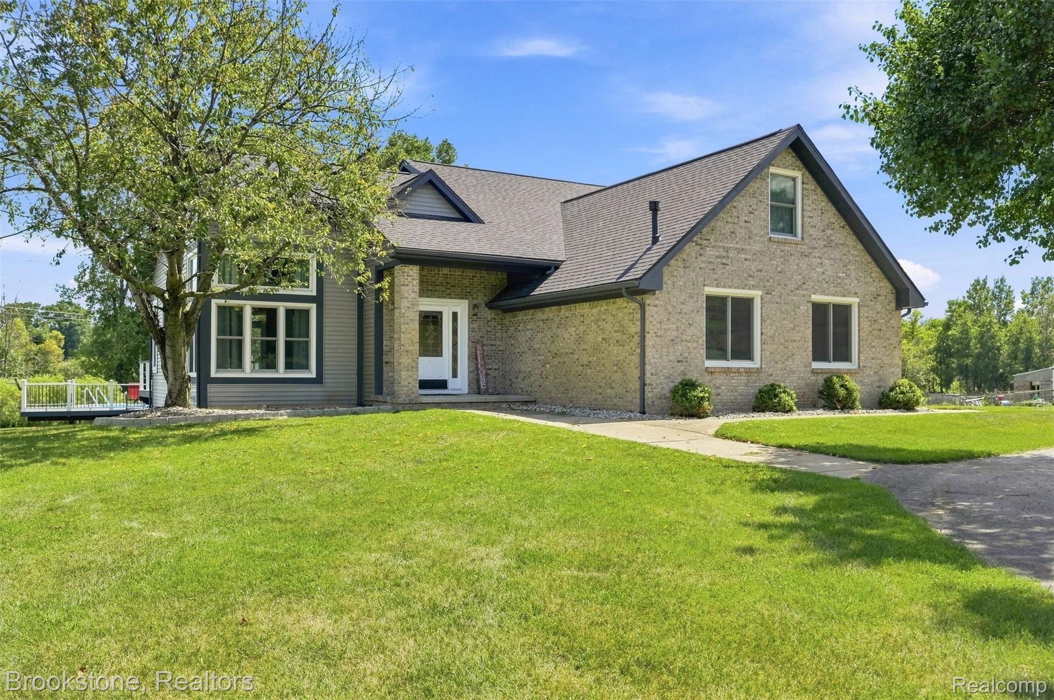 1775 Dutcher Road Howell, MI 48843 - Photo 1 of 41 Brick and siding exterior with a gabled roof