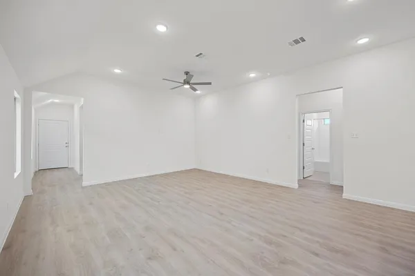 a kitchen with appliances a sink and cabinets