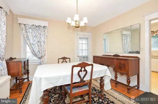 a bedroom with furniture and a chandelier
